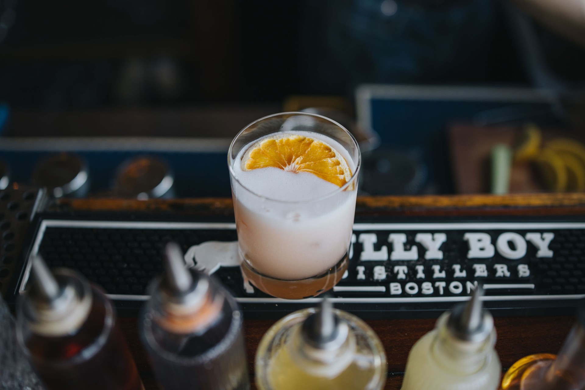 A whiskey sour with dried citrus on the bar at Nor'East