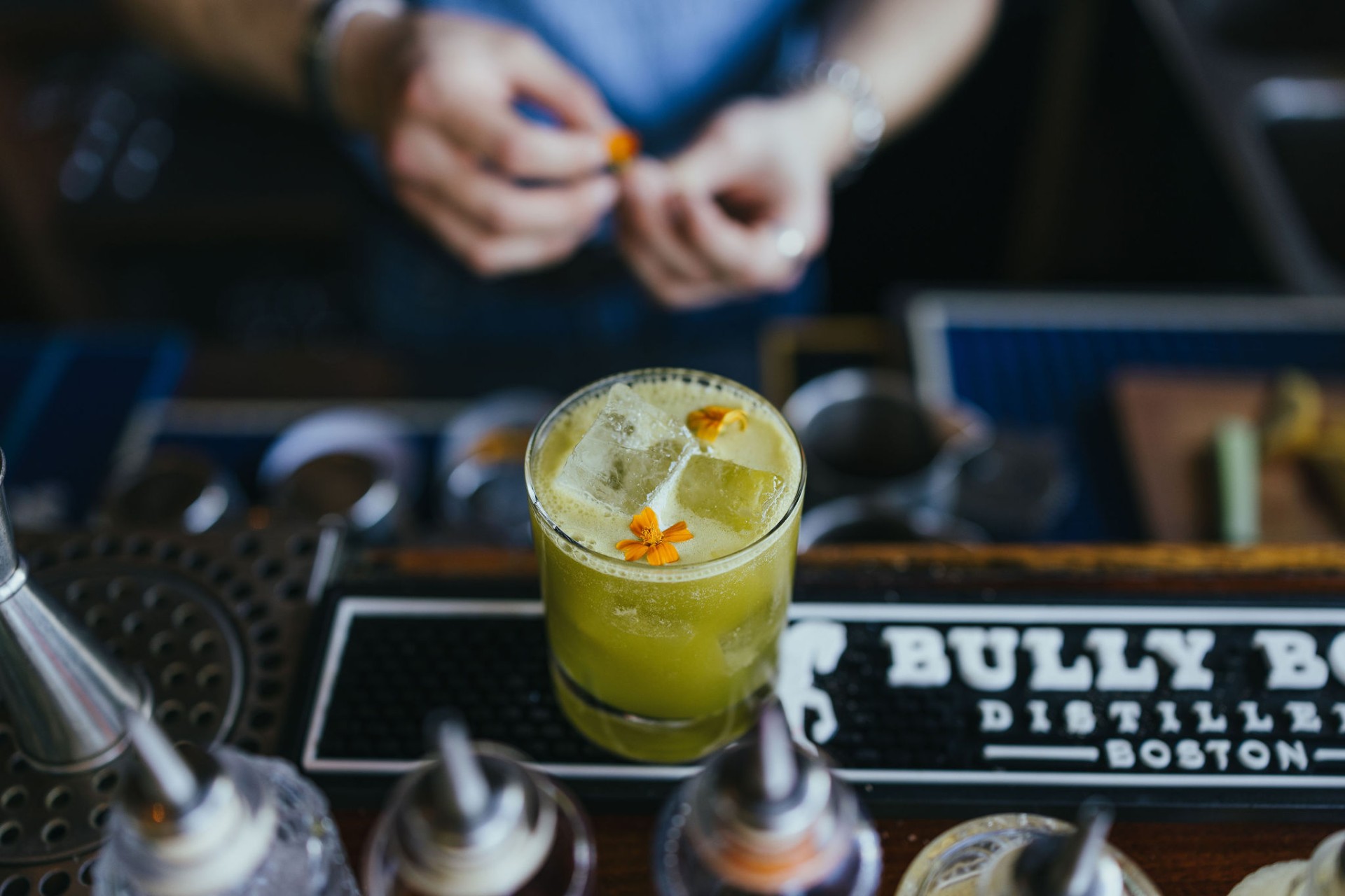 Green garden cocktail with marigold petals