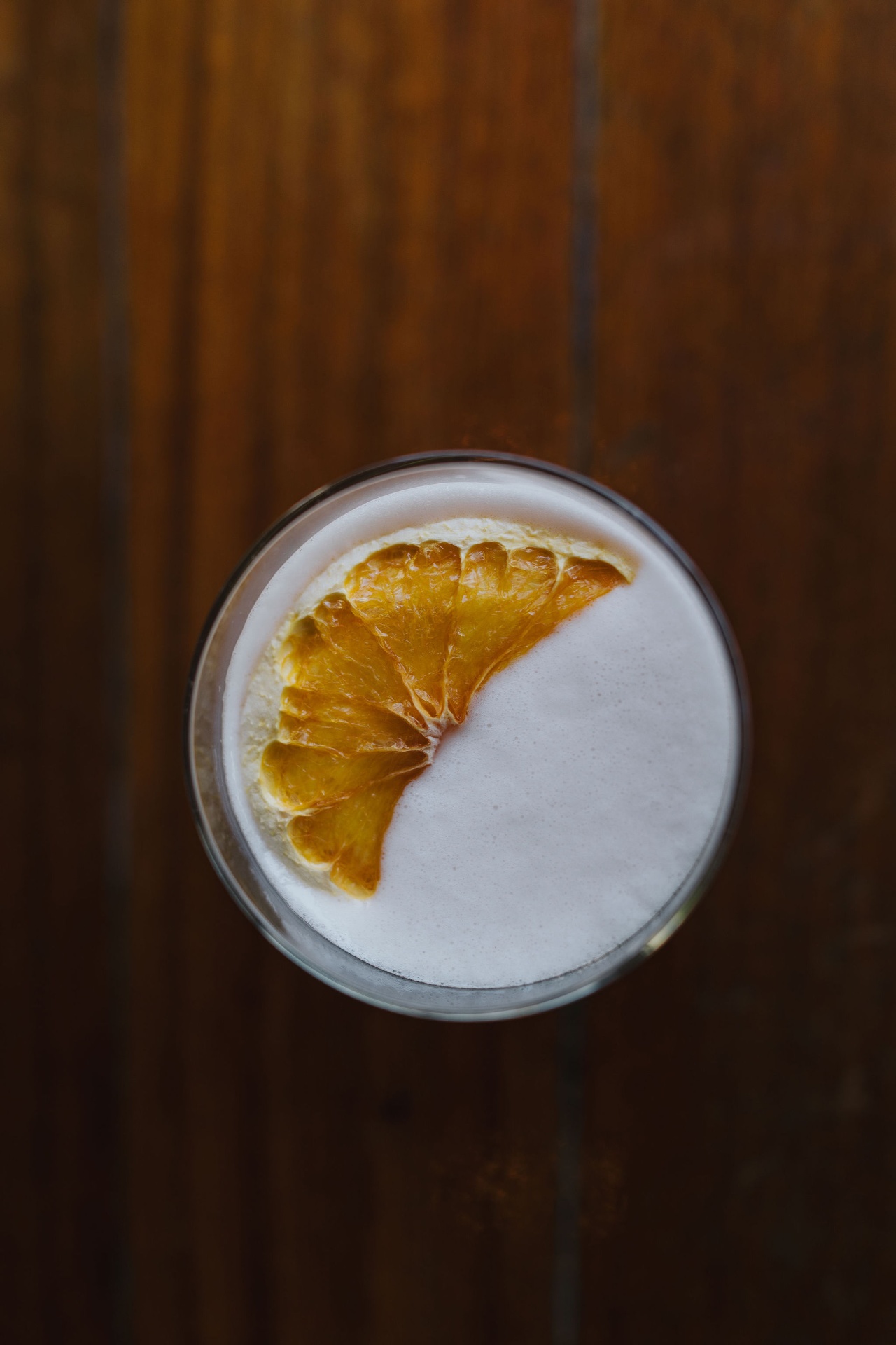 Whiskey sour with dried citrus, overhead